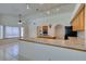Bright kitchen with tile countertops and an attached breakfast nook at 399 Discovery Ct, Henderson, NV 89014