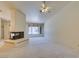 Spacious living room featuring a fireplace and a large bright window at 399 Discovery Ct, Henderson, NV 89014