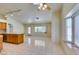 Spacious living area featuring tile floors, neutral walls, and natural light at 399 Discovery Ct, Henderson, NV 89014