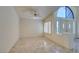 Open living area offering tile flooring, recessed lighting, shuttered windows, and a view of the front entrance at 399 Discovery Ct, Henderson, NV 89014