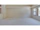 Open living room featuring new carpet and natural light from the window at 399 Discovery Ct, Henderson, NV 89014