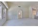 Bright living room featuring neutral carpet and large windows for natural light at 399 Discovery Ct, Henderson, NV 89014