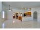 Spacious living room featuring tile floors and is open to the kitchen and dining areas at 399 Discovery Ct, Henderson, NV 89014