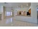 Spacious living room featuring tile floors and is open to the kitchen and dining areas at 399 Discovery Ct, Henderson, NV 89014