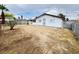 Spacious backyard featuring a partially wooden fence and desert landscaping at 4303 Paramount St, Las Vegas, NV 89115