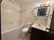 Bathroom featuring a vanity, toilet, and shower/tub combination at 4303 Paramount St, Las Vegas, NV 89115
