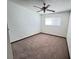 Cozy bedroom featuring a ceiling fan, carpet, and a bright window at 4303 Paramount St, Las Vegas, NV 89115