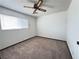 Bright bedroom featuring carpet, ceiling fan, and natural light at 4303 Paramount St, Las Vegas, NV 89115