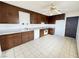 Functional kitchen with dark wood cabinets and tiled flooring at 4303 Paramount St, Las Vegas, NV 89115