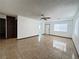 Bright living area boasts tiled flooring and neutral paint at 4303 Paramount St, Las Vegas, NV 89115