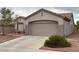 Charming single-story home with desert landscaping and a spacious two car garage at 438 Fountain Grove St, Henderson, NV 89012