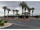 Elegant building exterior framed by palm trees and lush landscaping in a well-maintained community at 438 Fountain Grove St, Henderson, NV 89012