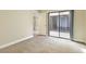 Bedroom featuring sliding glass doors and neutral-colored carpet at 4687 Madreperla St, Las Vegas, NV 89121