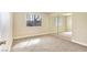 Neutral bedroom with a large window and mirrored closet doors, providing lots of natural light at 4687 Madreperla St, Las Vegas, NV 89121