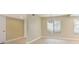 Well-lit dining room area with large window and neutral walls at 4687 Madreperla St, Las Vegas, NV 89121