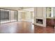 Spacious living room with a marble fireplace and hardwood floors at 4687 Madreperla St, Las Vegas, NV 89121