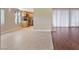 Open floor plan showcasing the living room with tile flooring, and a view of the kitchen at 4687 Madreperla St, Las Vegas, NV 89121