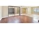 Bright living room with hardwood floors and sliding glass doors to the atrium at 4687 Madreperla St, Las Vegas, NV 89121