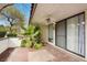 Outdoor patio area featuring tile flooring, a ceiling fan, and garden views at 4687 Madreperla St, Las Vegas, NV 89121