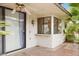 Enclosed patio area with tile flooring, windows, ceiling fan, and exterior light at 4687 Madreperla St, Las Vegas, NV 89121