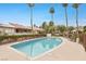 Community pool with lounge seating and palm trees, great for relaxation at 4687 Madreperla St, Las Vegas, NV 89121