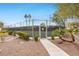 Community tennis court in a landscaped setting with shrubs and palm trees at 4687 Madreperla St, Las Vegas, NV 89121