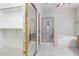 Bathroom featuring a tub, separate shower, and a walk-in closet with built-in shelving at 4760 Verdet St, Las Vegas, NV 89147