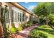 Charming home featuring a well-maintained lawn and beautiful desert landscaping at 4760 Verdet St, Las Vegas, NV 89147