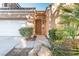 Close up of the front entrance with desert landscaping and a walkway at 4760 Verdet St, Las Vegas, NV 89147