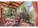 Comfortable outdoor patio area with drapes, misting system, and backyard views at 4760 Verdet St, Las Vegas, NV 89147