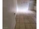 A view of a bedroom showing tile floors and white walls with shelving at 500 Prescott St, Las Vegas, NV 89110