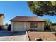Charming single-story home featuring a red-tiled roof, attached garage, and low-maintenance desert landscaping at 500 Prescott St, Las Vegas, NV 89110