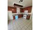 Traditional kitchen boasts wooden cabinets, tiled flooring, and modern appliances at 500 Prescott St, Las Vegas, NV 89110