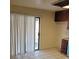 View of a kitchen with tiled flooring, sliding glass door, and rich, dark cabinetry at 500 Prescott St, Las Vegas, NV 89110