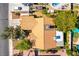 Bird's-eye view reveals the property's tile roof, backyard pool, and carefully designed landscaping enhancing the outdoor living space at 5104 Drummond Rd, Las Vegas, NV 89130
