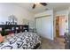 Cozy bedroom features a ceiling fan, dresser and built in bookcase headboard at 5104 Drummond Rd, Las Vegas, NV 89130