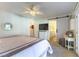 Primary bedroom features a ceiling fan and access to the en suite bathroom at 5104 Drummond Rd, Las Vegas, NV 89130