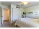 Inviting bedroom with bright walls, a ceiling fan and a mirrored closet at 5104 Drummond Rd, Las Vegas, NV 89130