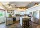 Modern kitchen with white cabinetry, granite countertops, stainless steel appliances, and a breakfast bar at 5104 Drummond Rd, Las Vegas, NV 89130