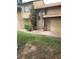 Exterior shot of a townhome with minimal landscaping and xeriscape at 513 Kristin Ln, Henderson, NV 89011