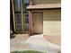 Close up of a townhome entrance featuring xeriscape and unique security door at 513 Kristin Ln, Henderson, NV 89011