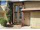 Townhome featuring an ornate security door, large windows, and tidy xeriscape at 513 Kristin Ln, Henderson, NV 89011