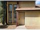 A townhome with a unique security door, large windows, and xeriscape at 513 Kristin Ln, Henderson, NV 89011