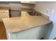 A kitchen with neutral color countertop and white cabinets at 513 Kristin Ln, Henderson, NV 89011