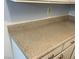 Countertops are neutral-toned and cabinets are white in this kitchen at 513 Kristin Ln, Henderson, NV 89011