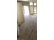 Bright living room with tall windows allowing ample natural light and neutral carpeting at 513 Kristin Ln, Henderson, NV 89011