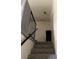Carpeted stairs with modern black railing leading to upper level at 513 Kristin Ln, Henderson, NV 89011
