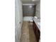 Full bathroom featuring a granite vanity, tub, and tile flooring at 5295 Indian River Dr # 305, Las Vegas, NV 89103