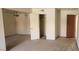 Spacious bedroom featuring neutral carpet, walk-in closet, and a ceiling fan at 5295 Indian River Dr # 305, Las Vegas, NV 89103