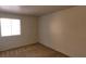 Simple bedroom featuring natural light and neutral-colored carpet at 5295 Indian River Dr # 305, Las Vegas, NV 89103